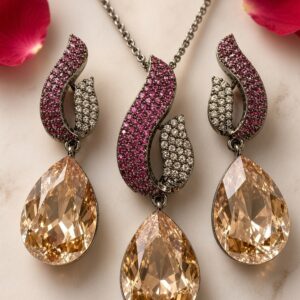 The Serpentina Ruby And Pavè Peach Pear-Cut Pendant Set-Black Rhodium Finish
