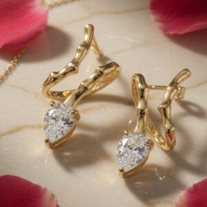 The Serpentine Pear-Cut Studs-Gold Finish